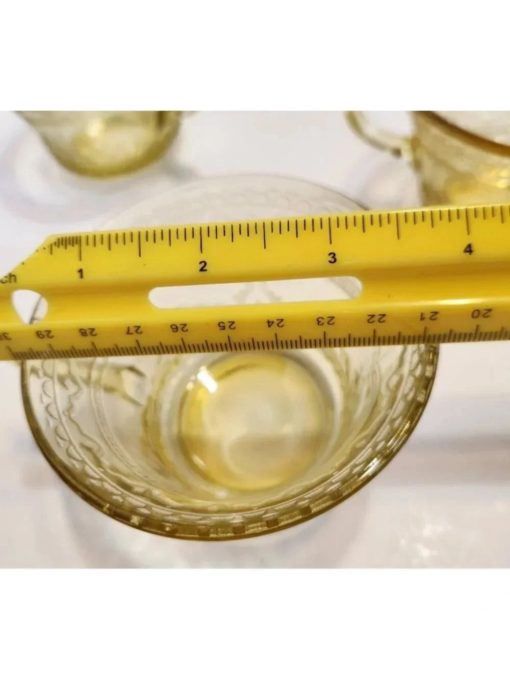 Elegant Amber Glass Teacup with Etched Decorative Pattern